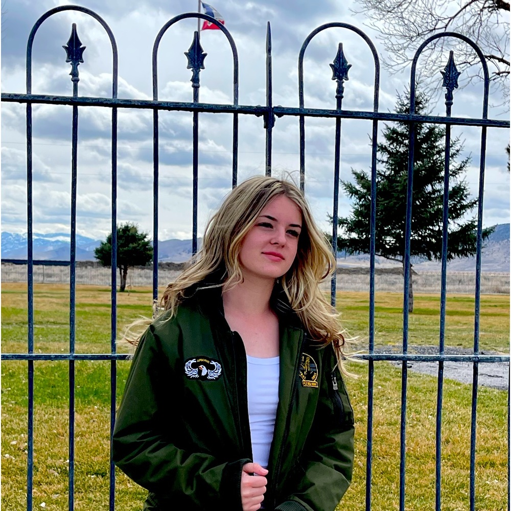 Xray olive bomber jacket with black hoodie.